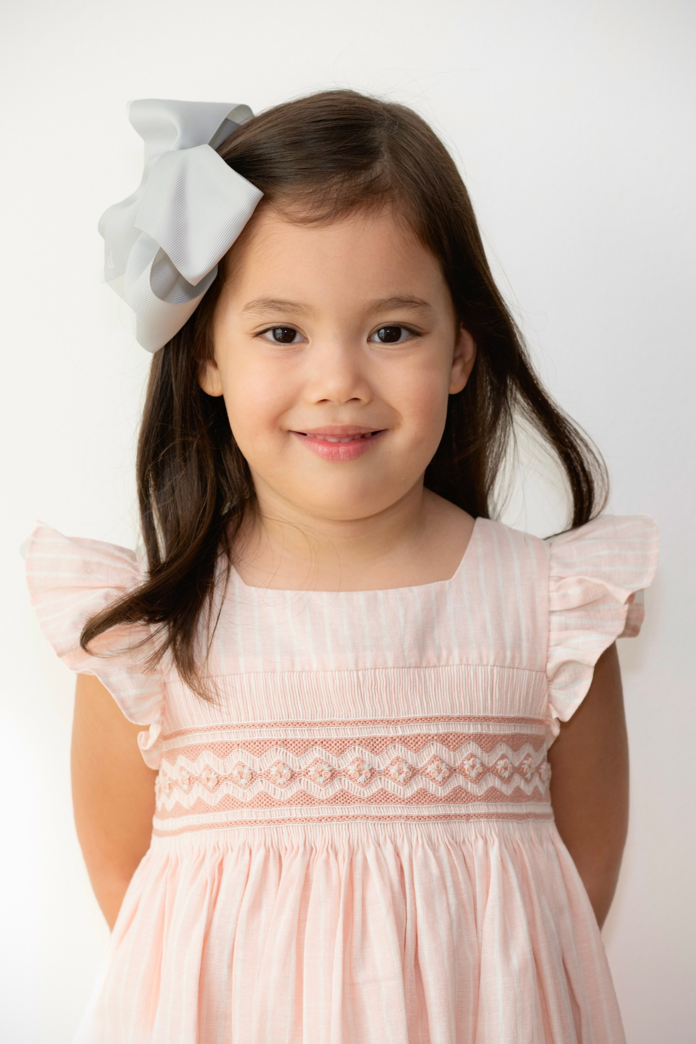 Charlotte sy Dimby classic timeless traditional smocked dresses for babies and girls handmade French style children clothing paris boutique soft pink striped dress singapour