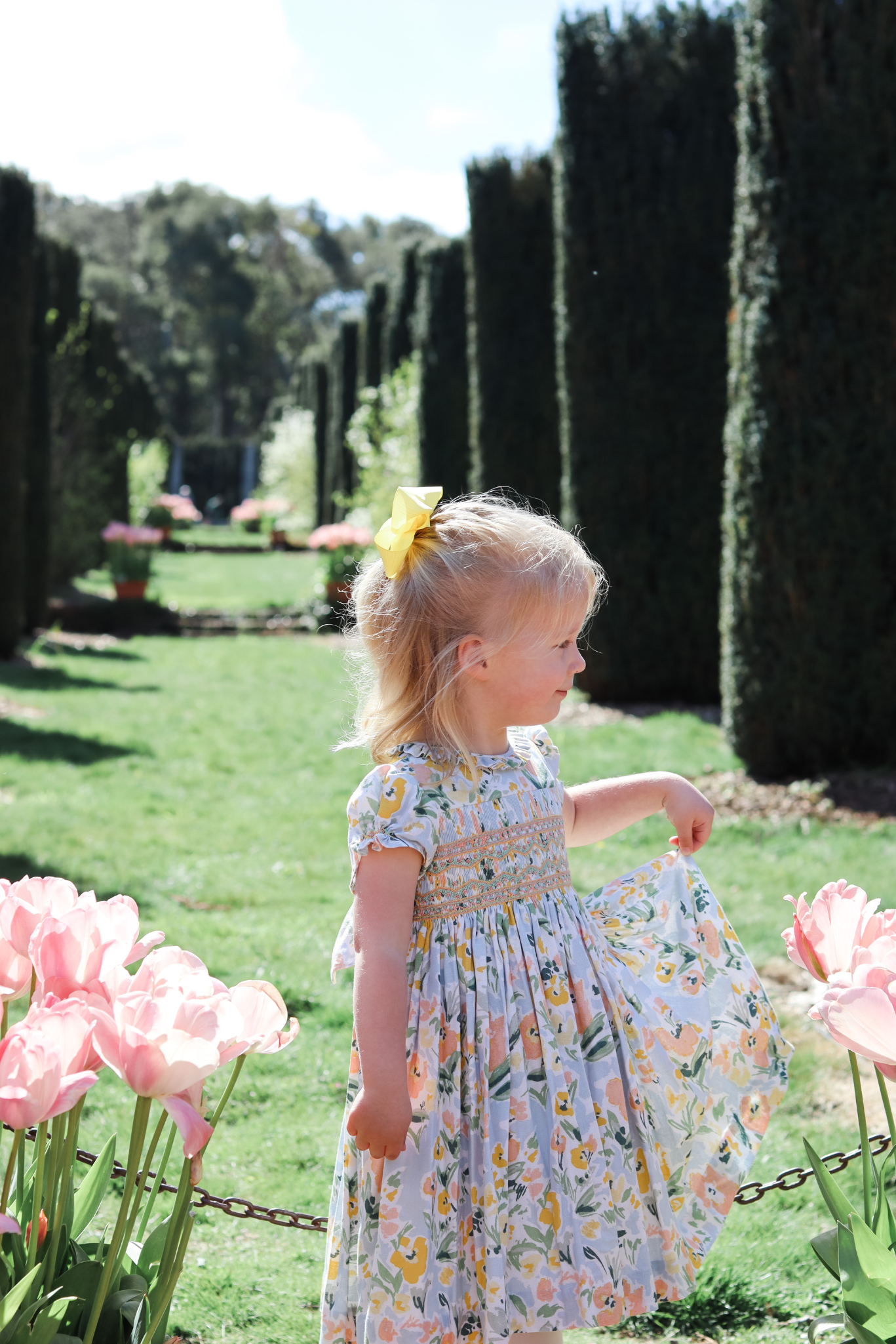 Charlotte sy Dimby classic timeless traditional smocked dresses for babies and girls handmade French style children clothing paris boutique  floral print spring easter dress filoli garden photo shoot california