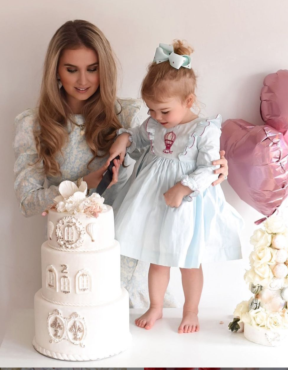 Charlotte sy Dimby classic timeless traditional smocked dresses for babies and girls handmade French style children clothing paris boutique twirling princess dress birthdat hot air balloon themed dress netherlands embroidery